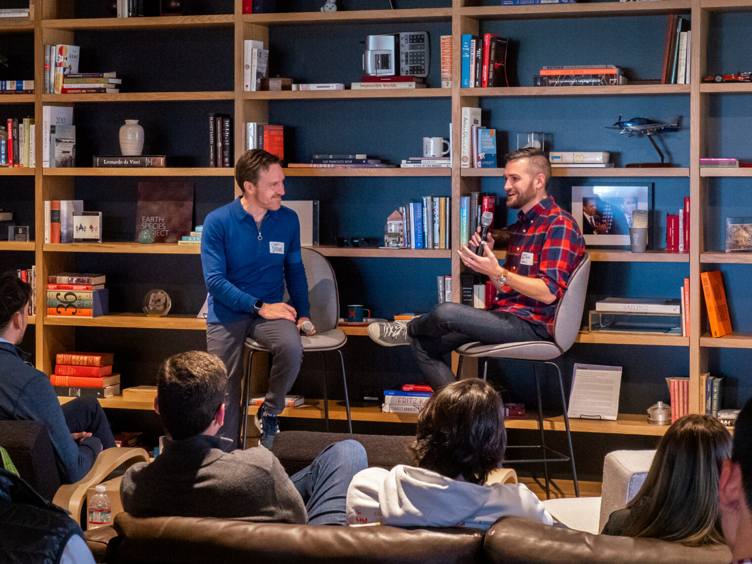 Steve Vassolo and another gentlemen giving a speech at the Stanford Crypto happy hour event