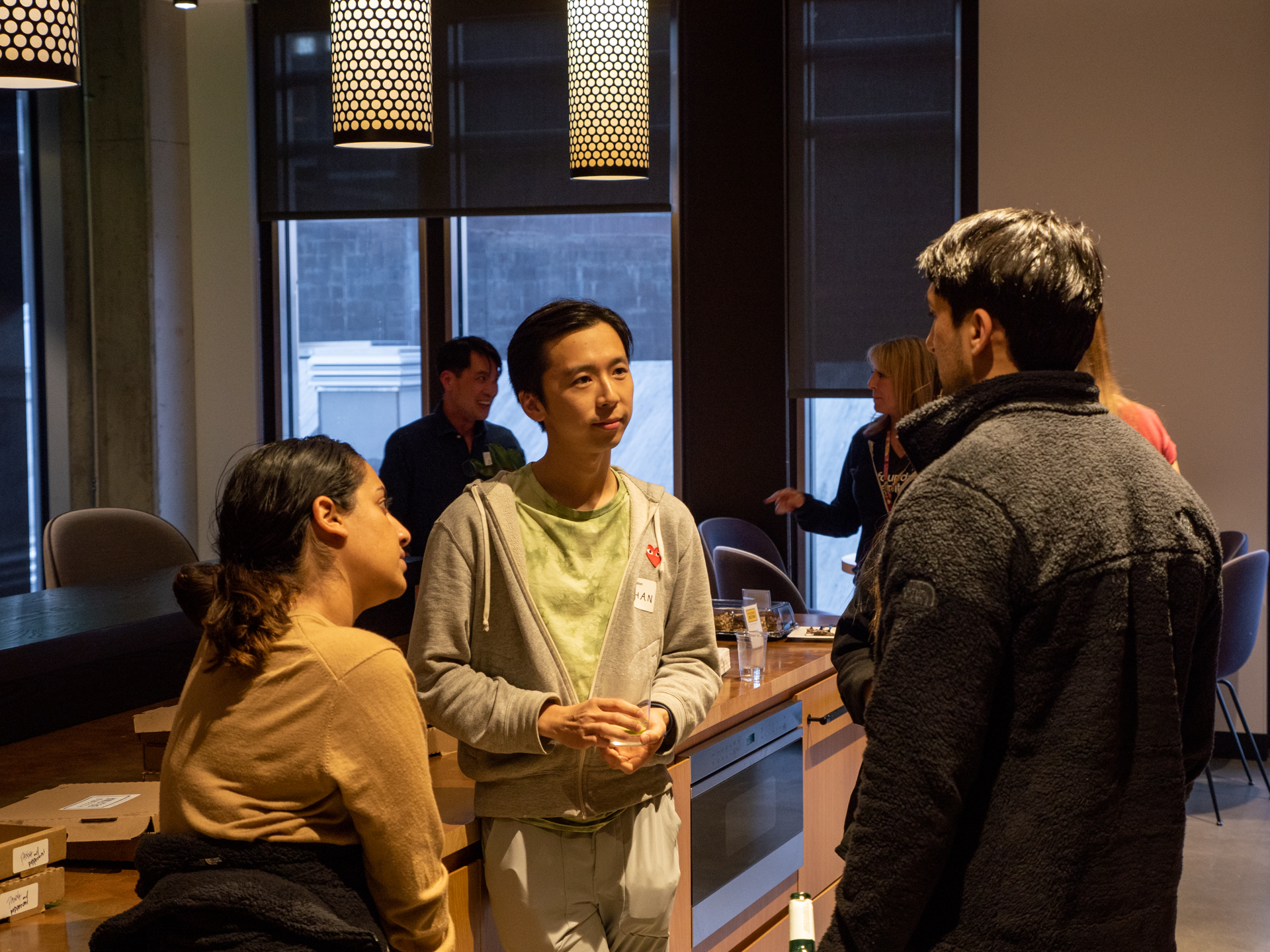 People mingling at the Stanford crypto happy hour event